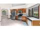 Bright kitchen featuring stainless steel appliances, wood cabinets and white countertops at 3808 Hollow Wood Dr, Valrico, FL 33594