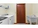 Practical laundry room with washer, dryer, utility sink and storage at 3808 Hollow Wood Dr, Valrico, FL 33594