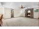 Large living room featuring a brick fireplace, carpet flooring and neutral walls at 3808 Hollow Wood Dr, Valrico, FL 33594