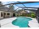 A beautiful view of the backyard pool and patio area perfect for entertaining and relaxation at 3808 Hollow Wood Dr, Valrico, FL 33594