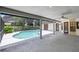 A covered lanai overlooks the pool, creating an ideal space for relaxation and enjoying outdoor living at 3808 Hollow Wood Dr, Valrico, FL 33594