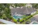 Aerial view of a screened-in pool area in the backyard, providing a private outdoor retreat at 3808 Hollow Wood Dr, Valrico, FL 33594