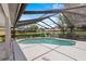 A refreshing screened-in pool offers the perfect retreat for relaxation and enjoyment at 3808 Hollow Wood Dr, Valrico, FL 33594