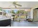 Screened-in patio with outdoor dining and relaxing furniture at 408 Pineapple St, Tarpon Springs, FL 34689