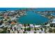 Expansive aerial view of waterfront homes and docks in a charming coastal community at 412 20Th Ave, Indian Rocks Beach, FL 33785