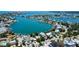 Waterfront homes sit along canals in this aerial view showcasing the beautiful, sunny neighborhood at 412 20Th Ave, Indian Rocks Beach, FL 33785