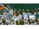 Aerial view of waterfront property with multiple docks, lifts, pools, and convenient parking spaces at 412 20Th Ave, Indian Rocks Beach, FL 33785
