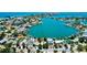 Expansive aerial view of waterfront homes and docks in a charming coastal community at 412 20Th Ave, Indian Rocks Beach, FL 33785