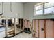 View of gutted bathroom showcasing the tile walls, window, and shower area at 412 20Th Ave, Indian Rocks Beach, FL 33785