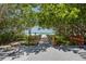 Scenic beach access walkway through lush greenery at 412 20Th Ave, Indian Rocks Beach, FL 33785
