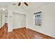 Spare bedroom with hardwood floors, a window, and an open closet at 4326 Venice Dr, Land O Lakes, FL 34639