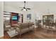 Open concept living room featuring a ceiling fan, modern decor, and seamless flow into the dining area at 4326 Venice Dr, Land O Lakes, FL 34639