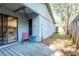 Back porch with sliding glass doors, kitchen view, and wooden deck at 4442 Summer Oak Dr, Tampa, FL 33618