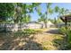 Large fenced backyard with mature trees and landscaping at 4442 Summer Oak Dr, Tampa, FL 33618