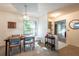 Inviting dining area featuring an elegant chandelier and seamless flow into living spaces at 4442 Summer Oak Dr, Tampa, FL 33618