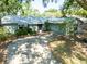 Charming single-story home featuring a spacious driveway, attached garage, and a well-maintained landscaped front yard at 4442 Summer Oak Dr, Tampa, FL 33618