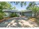 Charming home with a driveway, mature trees, and well-maintained landscaping at 4442 Summer Oak Dr, Tampa, FL 33618