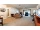 A cozy living room with comfortable seating, a ceiling fan, and a sliding door leading to the outdoors at 4442 Summer Oak Dr, Tampa, FL 33618