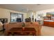 A cozy living room with comfortable seating, a ceiling fan, and a sliding door leading to the outdoors at 4442 Summer Oak Dr, Tampa, FL 33618