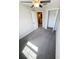 Bright bedroom featuring carpeted floors, ceiling fan, and a view of the hallway at 4461 Globe Thistle Dr, Tampa, FL 33619