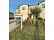 Exterior view of a two-story townhome with a For Sale sign at 4461 Globe Thistle Dr, Tampa, FL 33619