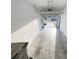 Bright garage with white walls and a view out to the driveway at 4461 Globe Thistle Dr, Tampa, FL 33619