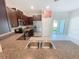 Modern kitchen with stainless steel appliances, granite countertops, and dark wood cabinets at 4461 Globe Thistle Dr, Tampa, FL 33619