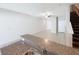 Open living room and kitchen area with granite countertops and neutral tones at 4461 Globe Thistle Dr, Tampa, FL 33619