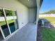 Covered patio with concrete flooring, and sliding glass doors, and outdoor air conditioning units at 4461 Globe Thistle Dr, Tampa, FL 33619