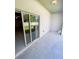 Outdoor patio with sliding glass doors and ample space for outdoor seating, perfect for relaxation and entertainment at 4461 Globe Thistle Dr, Tampa, FL 33619