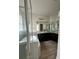 Bathroom featuring granite countertops, modern fixtures, walk-in shower and a bathtub at 4697 Wandering Way, Wesley Chapel, FL 33544