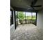 Relaxing screened patio with brick floors and views of the water and landscaping at 4697 Wandering Way, Wesley Chapel, FL 33544