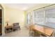 Bright dining area featuring a wooden table with seating and a large window at 5216 81St N St # 2, St Petersburg, FL 33709