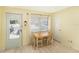 Cozy dining area featuring bright light, modern decor, and a convenient door to the outdoors at 5216 81St N St # 2, St Petersburg, FL 33709