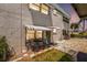 Condo exterior showcasing a quaint patio area with seating and colorful surroundings at 5216 81St N St # 2, St Petersburg, FL 33709