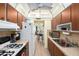 Efficient kitchen with bright cabinets, functional appliances, and seamless connection to the dining area at 5216 81St N St # 2, St Petersburg, FL 33709