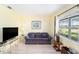 Cozy living room featuring a comfortable couch, a window, and light-filled space at 5216 81St N St # 2, St Petersburg, FL 33709