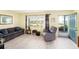 Relaxing living area with a plush couch, recliner, and natural light from the window at 5216 81St N St # 2, St Petersburg, FL 33709