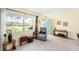 Inviting living room with ample seating, light wood flooring, and a view of the outdoors at 5216 81St N St # 2, St Petersburg, FL 33709