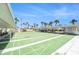 Enjoy outdoor community shuffleboard courts surrounded by mature landscaping and shaded seating areas at 5216 81St N St # 2, St Petersburg, FL 33709
