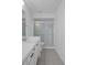 Bright bathroom featuring a single sink vanity and a glass-enclosed shower at 601 N Hercules Ave # 1602, Clearwater, FL 33765