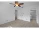 Comfortable bedroom featuring tiled floors, ceiling fan, and access to closet and bathroom at 601 N Hercules Ave # 1602, Clearwater, FL 33765