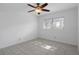 Cozy bedroom with tiled floor, a ceiling fan, and a window at 601 N Hercules Ave # 1602, Clearwater, FL 33765