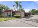 Exterior of condo with covered parking and mature trees at 601 N Hercules Ave # 1602, Clearwater, FL 33765