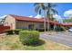 Clean building exterior with mature landscaping and ample parking at 601 N Hercules Ave # 1602, Clearwater, FL 33765