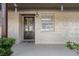 Charming front entryway featuring a secure door and a welcoming, covered porch area at 601 N Hercules Ave # 1602, Clearwater, FL 33765