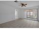 Inviting living room with open floor plan, neutral walls, and sliding door access to outdoor patio at 601 N Hercules Ave # 1602, Clearwater, FL 33765