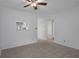 Open-concept living room with neutral tile flooring and an open view of the bright, renovated kitchen at 601 N Hercules Ave # 1602, Clearwater, FL 33765