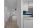 Spacious living room with neutral tile flooring, white walls, and seamless access to the kitchen at 601 N Hercules Ave # 1602, Clearwater, FL 33765