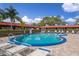 Relaxing pool area with lounge chairs and clear blue water, ideal for summer enjoyment at 601 N Hercules Ave # 1602, Clearwater, FL 33765